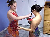 This scene is Danni and Cristal together again.  This time they are doing a messy scene.  They get naked on the floor and cover each other in body paint.  This is the amateur version of the Playboy Painted Ladies.